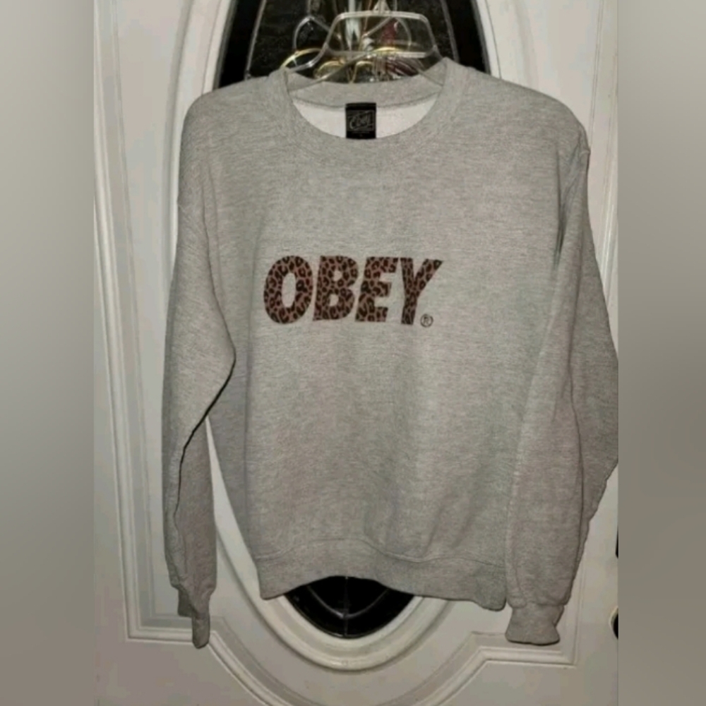 OBEY Women’s Pullover Sweatshirt Size Small Cheetah Print Spell Out